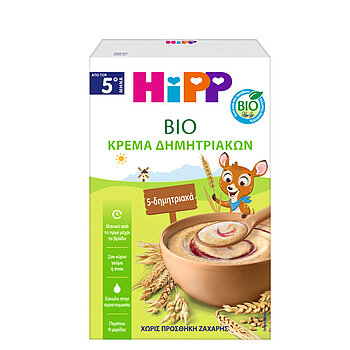 Ένα πράσινο κουτί με τη λέξη "BIO" σε περίοπτη θέση περιέχει ένα μπολ με ένα τρόφιμο μπεζ χρώματος, το οποίο περιβάλλεται από απεικονίσεις σιταριού και δημητριακών.