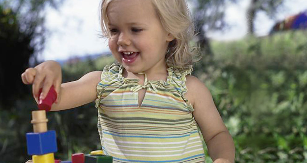 A child plays with colorful blocks.
